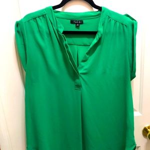Kelly green sleeveless blouse